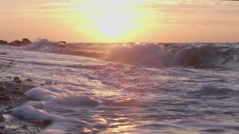 Waves-crashing-on-the-beach-at-sunset