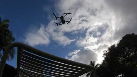 Drone-taking-off-from-suntan-bed,-Hawaii
