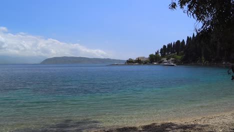 View-from-Kouloura-beach-of-the-bay-and-fishing-harbour,-Corfu,-Greece