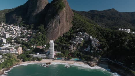 Aerial-approach-on-Vidigal-beach-with-the-shanty-town-community-and-Two-Brothers-mountain-in-the-background