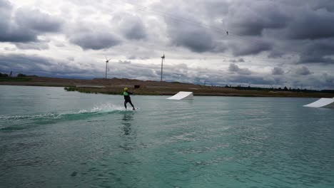 Young-man-wake-boarding-in-the-water-park