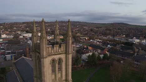 Aerial-view-of-St-Jame's-church-in-the-midlands,-Christian,-Roman-catholic-religious-orthodox-building-in-a-mainly-muslim-area-of-Stoke-on-Trent-in-Staffordshire,-City-of-Culture