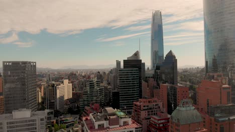 Aerial-Panorama-next-to-tall-buildings-flying-above-the-city-4K