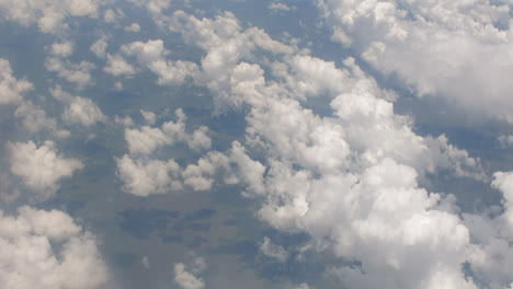 A-window-seat-view-from-a-charter-flight-from-OR-Tambo-International-Airport-from-cruising-altitude-of-33000ft-through-high-cumulonimbus-cloud-formations