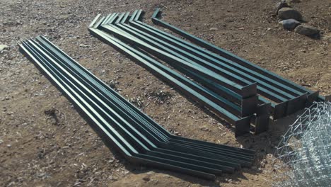 Stack-of-angle-iron-posts-welded-and-incomplete