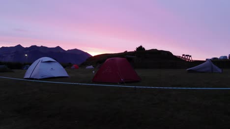 Camping-site-with-tents-and-mountain-ranges