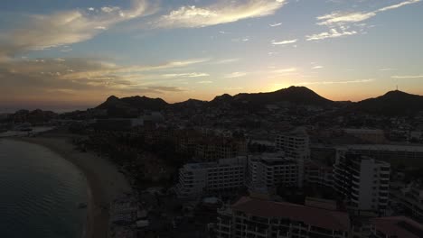 Aerial-drone-shot-of-the-sunset-in-Los-Cabos,-Baja-California-sur