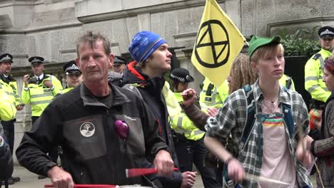 Extinction-Rebellion-protesters-play-music-near-Westminster-in-central-London,-UK