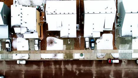 Snowy-roofs-from-a-late-March-storm-all-lined-up-in-this-4k-drone-shot