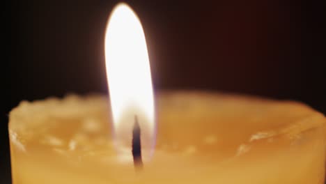 Macro-shot-of-a-candle-being-lit-with-a-lighter