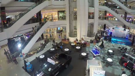 Nonthaburi-Thailand---Circa-Time-lapse-of-a-shopping-mall-where-crowds-move-through-multiple-layers-of-the-building-on-foot,-elevator,-and-escalator