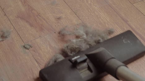 Hoovering-a-dirty-dusty-floor-with-an-electric-vacuum