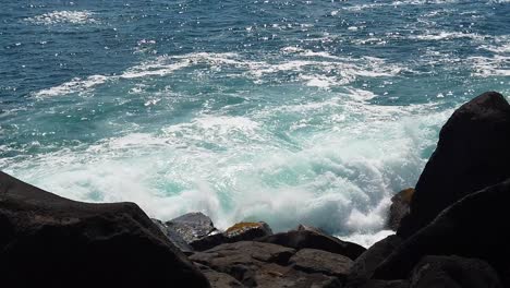 HD-Slow-motion-Hawaii-Kauai-static-of-ocean-waves-blasting-nice-ocean-spray-with-lava-rocks-in-foreground