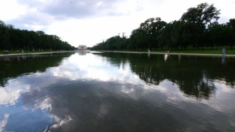 View-from-the-water-to-the-front-steps-of-the-Lincoln-Memorial-taken-from-the-reflection-pond-with-people-in-the-foreground