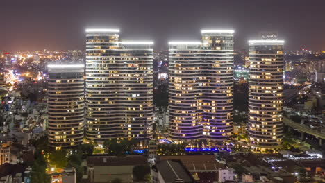 Epic-Aerial-Night-Hyperlapse-of-Binh-Thanh-District,-Hom-Chi-Minh-City-Vietnam-featuring-Hi-Rise-buildings-of-City-Garden-Development,Landmark-81-development-and-surrounding-buildings