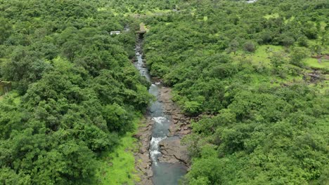 Drone-approaching-to-a-small-bridge-on-a-Jungle-stream-in-the-Western-Ghats-forest