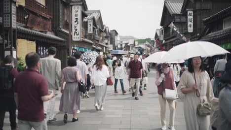 Japanese-People-Walking-On-The-Street-Of-Ise-In-Japan-On-A-Hot-Sunny-Day---midshot-slowmo