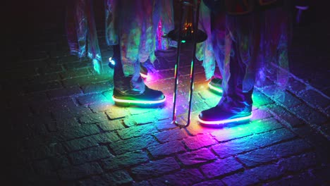 Kids-wearing-flashing-colorful-shoes,-blinking-in-rainbow-color