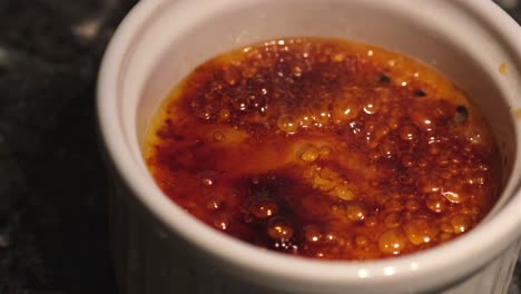 Burn-portion-of-french-dessert-cream-brulee-in-close-up