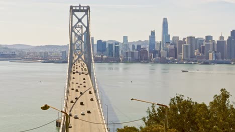 Bay-suspension-Bridge-San-Francisco-sunday-traffic-midday-sunny-february-timelapse-bay-area-downtown-copy-space