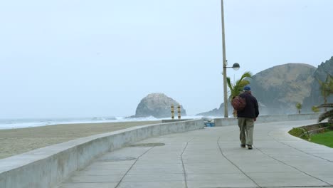 old-man-walking-on-the-coast