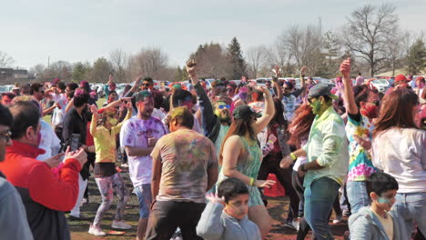 Large-crowd-of-people-dancing-together-at-open-air-Holi-Festival