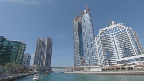 Dubai-Creek-and-Deira-district,-swim-through-luxurious-modern-city