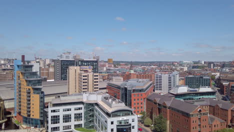 Tilting-Shot-of-Leeds-City-Centre-during-Sunny-Summer’s-Day-from-High-Vantage-Point-moving-from-the-River-Aire---Water-Taxi-to-Blue-Sky