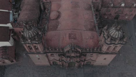 4k-daytime-aerial-drone-footage-over-the-main-Cathedral-from-Plaza-de-Armas-in-Cusco,-Peru-during-Coronavirus-lockdown