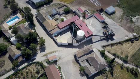 Aerial-overhead-shot-of-a-rural-town-in-the-south-of-Spain-with-an-oil-factory