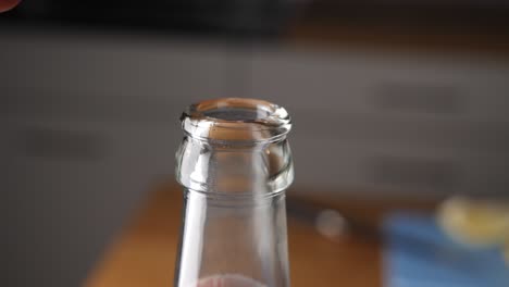 Opening-the-bottle-cap-of-a-fresh-beer-bottle---Slow-Motion
