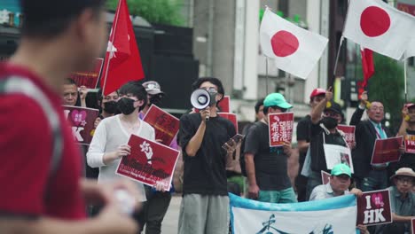 Solidarity-Protest-In-Tokyo,-Japan---Japanese-People-In-The-Street-Showing-Their-Support-For-Pro-Democracy-Protesters-In-Hong-Kong---medium-slowmo-shot