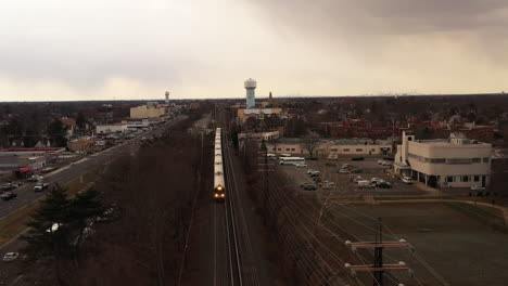 An-aerial-view-over-railroad-tracks-on-a-cloudy-day