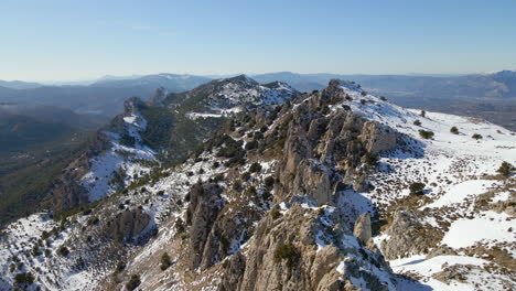 Aerial-view-of-the-snowy-mountains-of-Sierra-de-Serrella-in-Alicante,-Spain