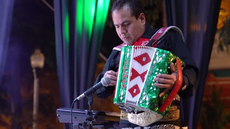 Closeup-of-mariachi-band-accordion-player-on-stage-in-Merida,-Mexico