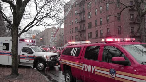 FDNY-Fleet-Service-Vehicle-and-ambulance-with-flashing-lights-responding-to-ConEd-incident---Wide-Static-shot