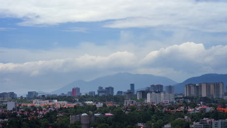 Timelapse-of-Clouds-Passing-Behind-Mountains-in-City