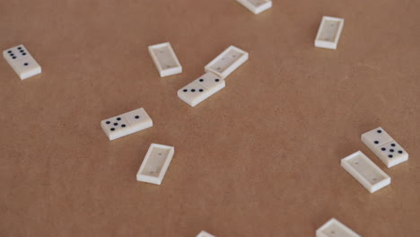 Group-of-domino-pieces-falling-onto-table