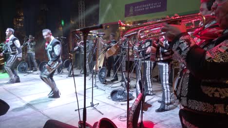 Wide-angle-shot-of-Mariachi-band-with-male-dancers-on-stage-in-Merida,-Yucatan,-Mexico