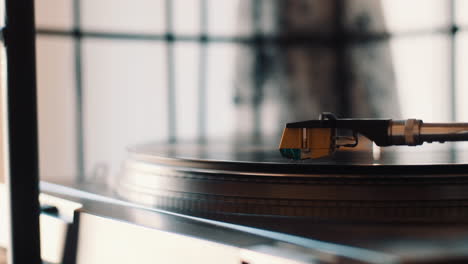 Dropping-the-needle-of-a-record-player-on-vinyl-to-play-music