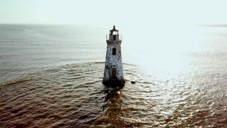 Aerial-pullout-Cockspur-Island-Lighthouse,-Tybee-Island-Georgia