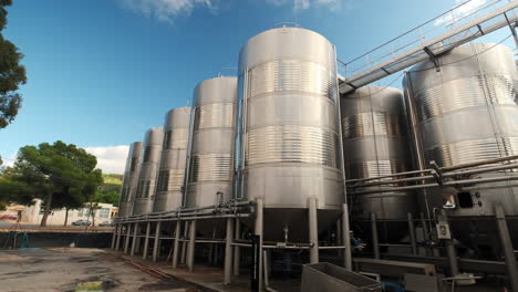 Large-Row-Of-Stainless-Steel-Wine-Distilling-Tanks