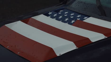 American-flag-decal-on-hood-of-drift-car,-close-up-circle-shot
