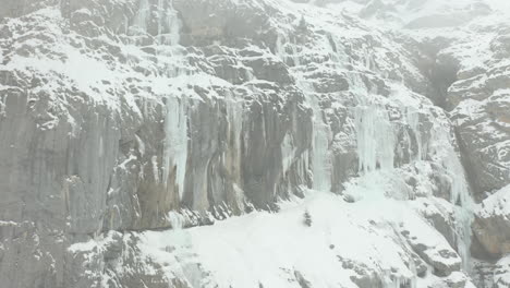 Jib-up-of-large-icicles-hanging-of-mountain-wall