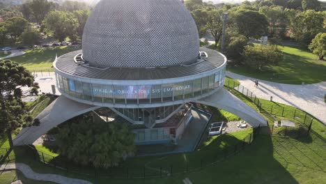 Aerial-rising-over-Galileo-Galilei-Planetarium-at-daytime-in-Palermo-Woods,-Buenos-Aires