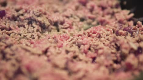 red-and-brown-minced-meat-cooking-in-pan-close-up