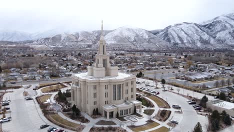 Drone-Orbit-Shot-Payson-Mormon-Temple-Utah-And-Snow-Covered-Mountains
