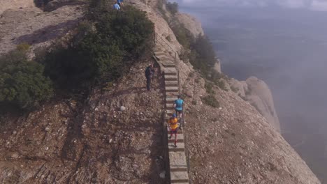 Marathon-runners-on-stairs-of-Montserrat-mountain,-Montserrat,-Spain