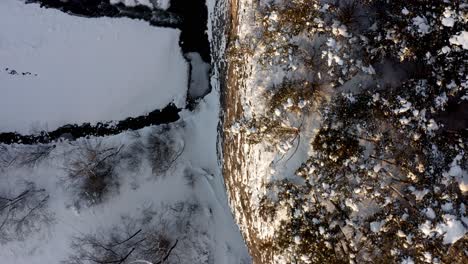 Trees-On-Top-Of-Cliff-With-Snowy-Stream-Below-At-Wintertime-Near-Bialka-Tatrzanska,-Poland