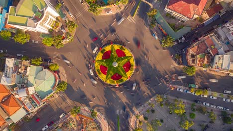 Drone-hyper-lapse-of-roundabout-with-traffic-moving-around-in-Nha-Trang-city,-Vietnam
